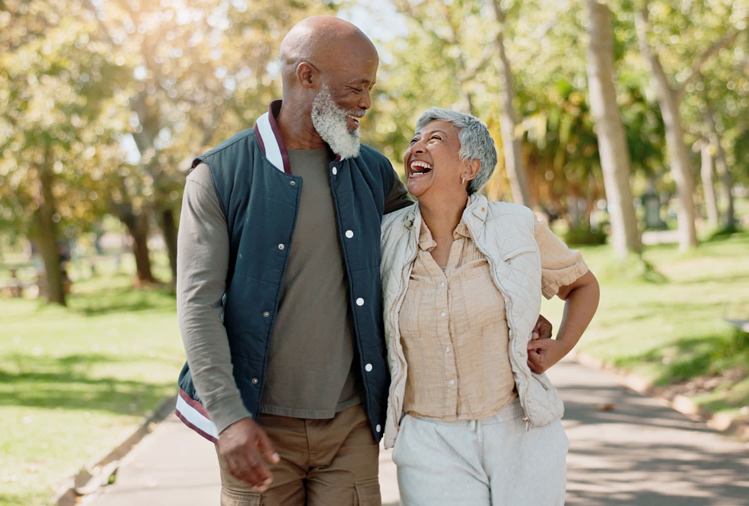Happy couple walking together in a park